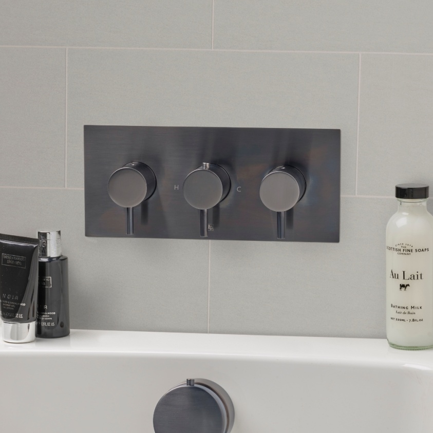 Close up product lifestyle image of the JTP Vos Brushed Black Triple Outlet Landscape Shower Valve